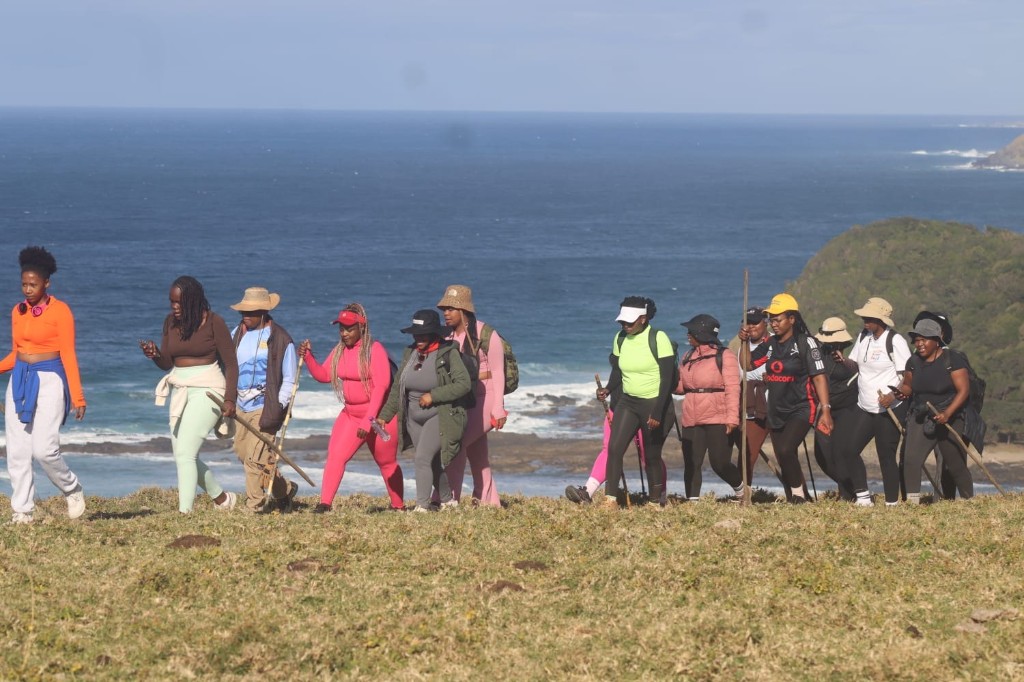 Women hiking on a ridge trail